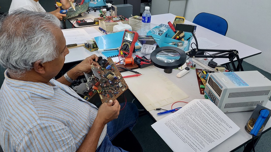 australia student taking electronics repair course