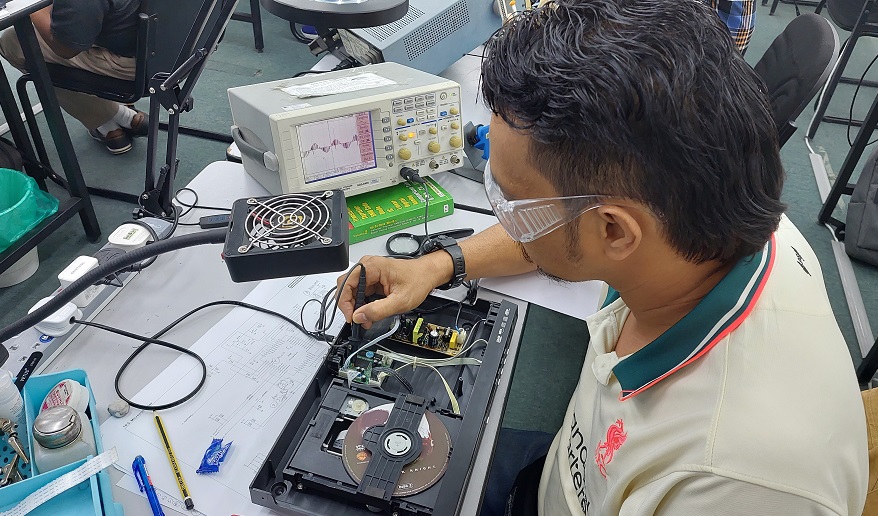 composite staff melaka taking electronics repair course